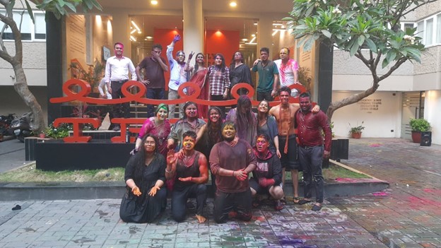 Group of friends click a picture during Holi celebration